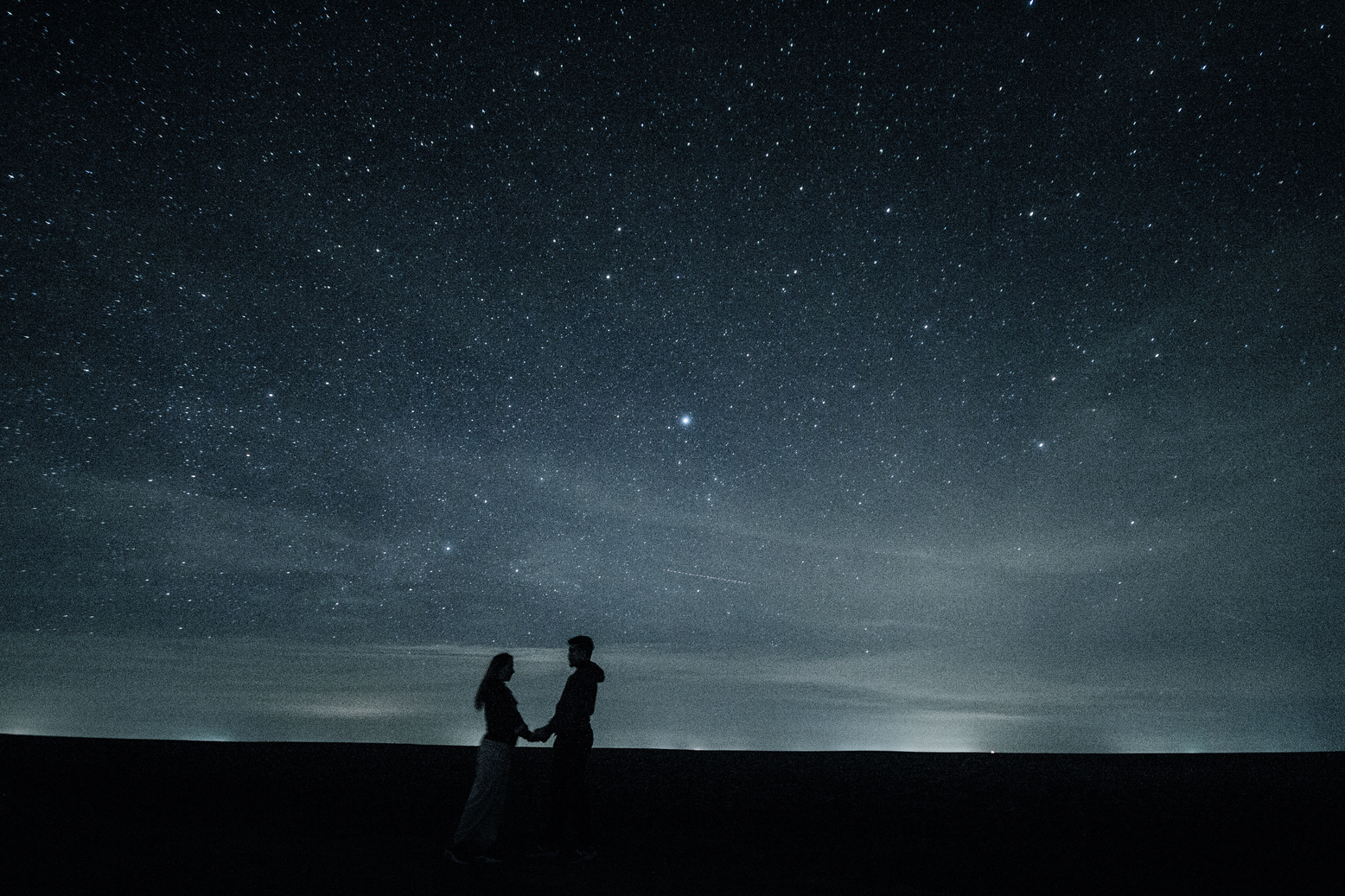Couple Under Starry Night Sky